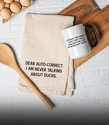 Kitchen items featuring a tea towel and mug